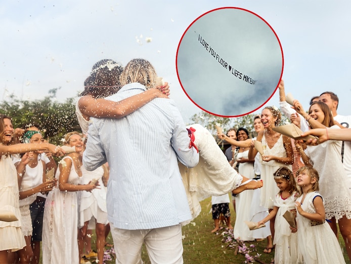 Op hun bruiloft verrast Mike zijn Floor met een liefdesboodschap in de lucht. Foto ter illustratie, het stel op de foto is niet het Twentse echtpaar.